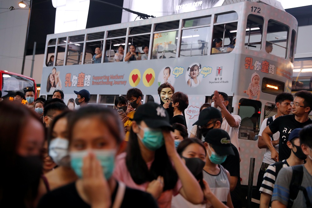 Anti-government protesters block a street during a march in Causeway Bay in solidarity with the student protester who got shot by police with live ammunition in Hong Kong October 2, 2019. u00e2u20acu201d Reuters pic