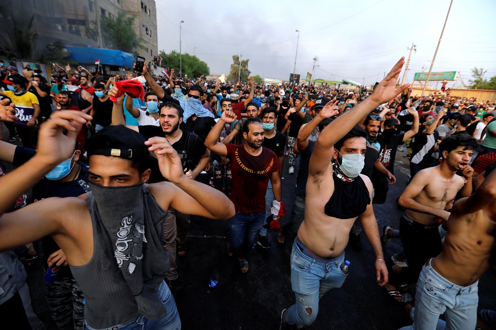 Demonstrators gesture at a protest over unemployment, corruption and poor public services, in Baghdad October 2, 2019. — Reuters pic