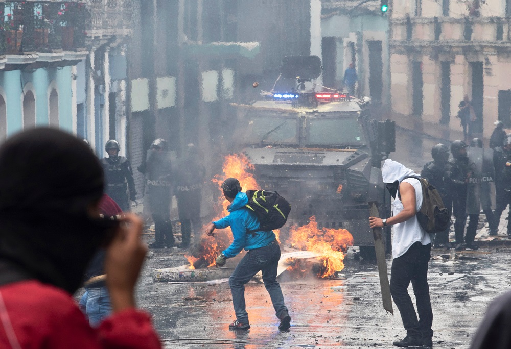 Demonstrators clash with riot police during protests after Ecuador’s President Lenin Moreno’s government ended four-decade-old fuel subsidies, in Quito, Ecuador October 3, 2019. — Reuters pic