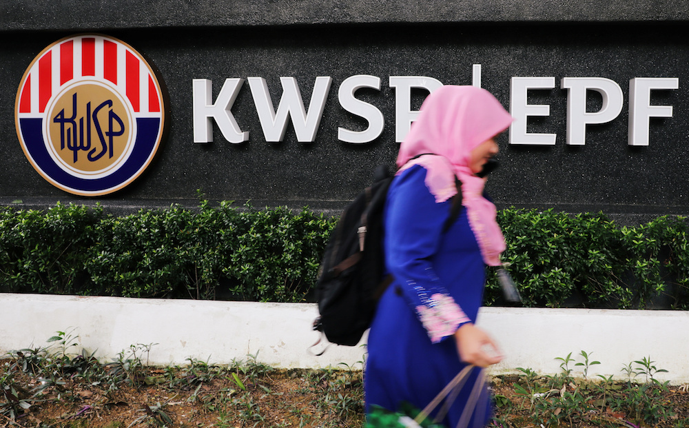 A woman walks past the Employeesu00e2u20acu2122 Provident Fund (EPF) headquarters in Kuala Lumpur September 5, 2019. u00e2u20acu201d Reuters pic