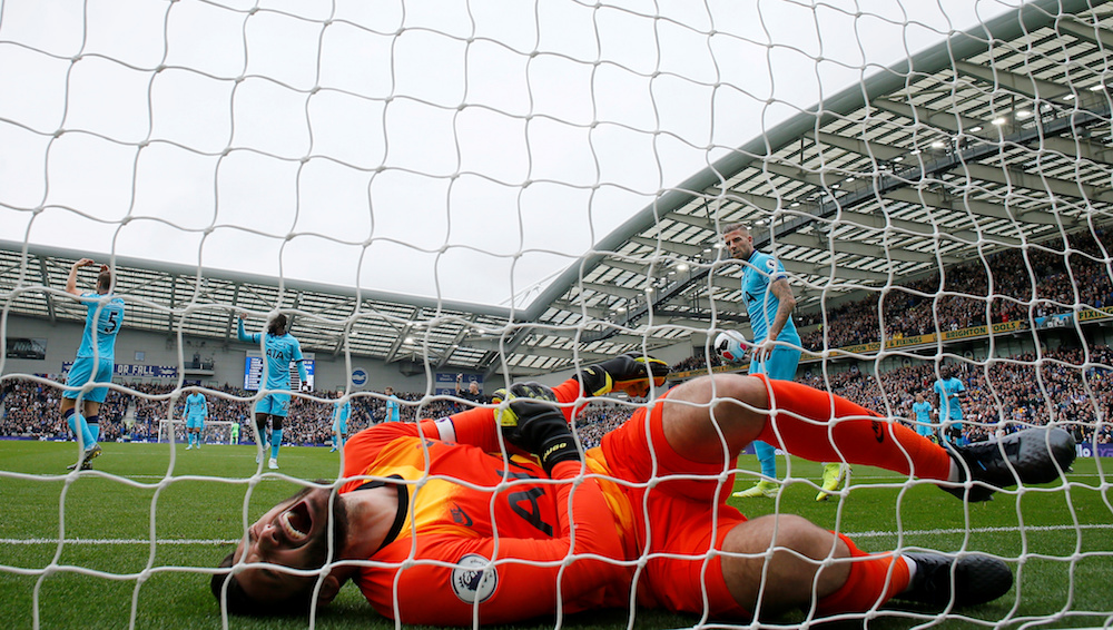 Tottenham Hotspuru00e2u20acu2122s Hugo Lloris reacts after sustaining an injury as Brighton and Hove Albionu00e2u20acu2122s Neal Maupay scored their first goal during their Premier League match in Brighton October 5, 2019. u00e2u20acu201d Action Images pic via Reuters