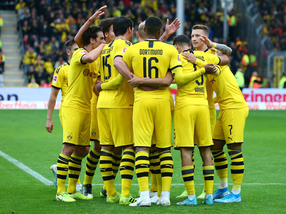 Borussia Dortmundu00e2u20acu2122s Achraf Hakimi celebrates scoring their second goal with teammates during the Bundesliga match with SC Freiburg at Schwarzwald-Stadion in Freiburg October 5, 2019. u00e2u20acu201d Reuters pic