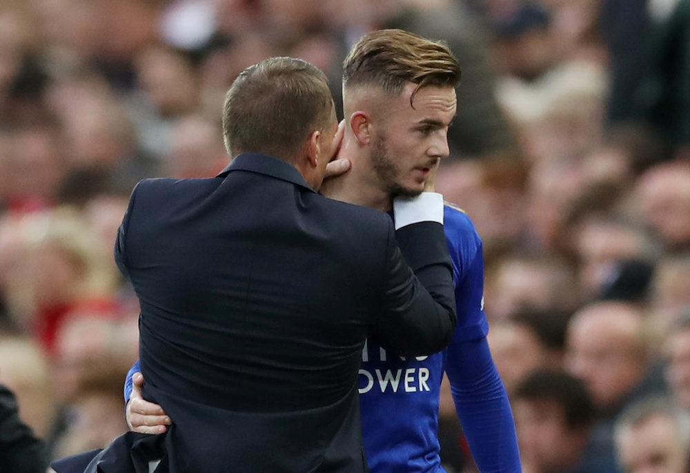 Leicester Cityu00e2u20acu2122s James Maddison is embraced by manager Brendan Rodgers after being substituted off during the Premier League match with Liverpool at Anfield in Liverpool October 5, 2019. u00e2u20acu201d Action Images pic via Reuters
