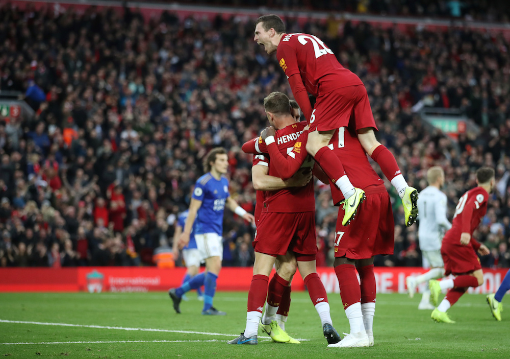 Liverpoolu00e2u20acu2122s James Milner celebrates scoring their second goal with Andrew Robertson and teammates during their Premier League match with Leicester City at Anfield in Liverpool October 5, 2019. u00e2u20acu201d Action Images pic via Reuters