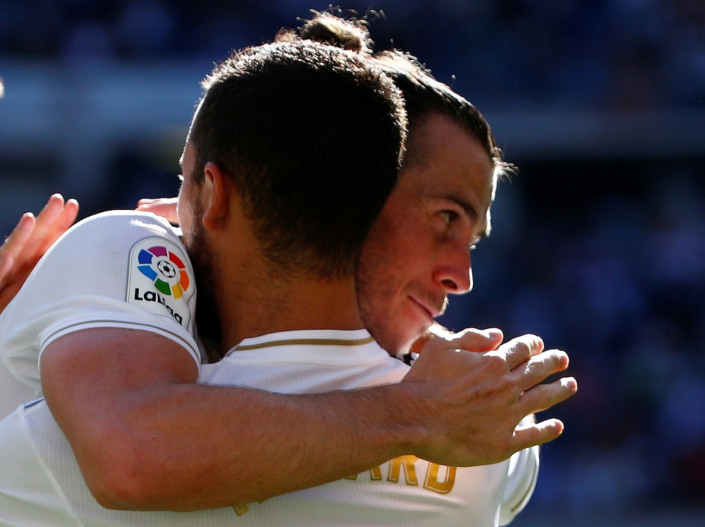 Real Madridu00e2u20acu2122s Eden Hazard celebrates scoring their second goal with Gareth Bale at the Santiago Bernabeu stadium in Madrid October 5, 2019. u00e2u20acu201d Reuters pic