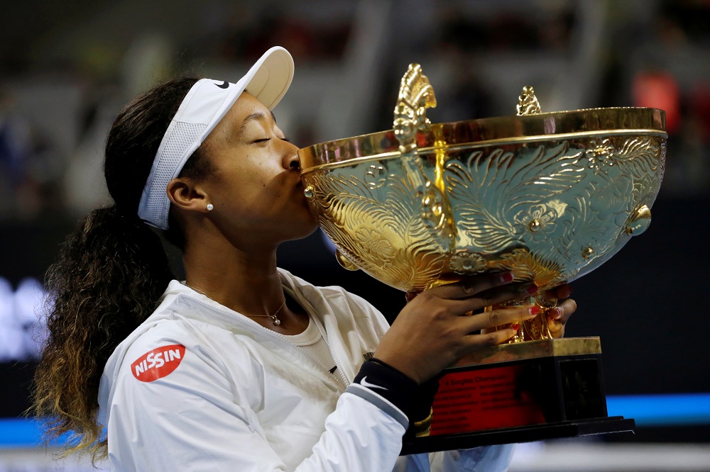 Naomi Osaka celebrates winning the China Open with her trophy at the National Tennis Centre in Beijing October 6, 2019. u00e2u20acu201d Reuters pic