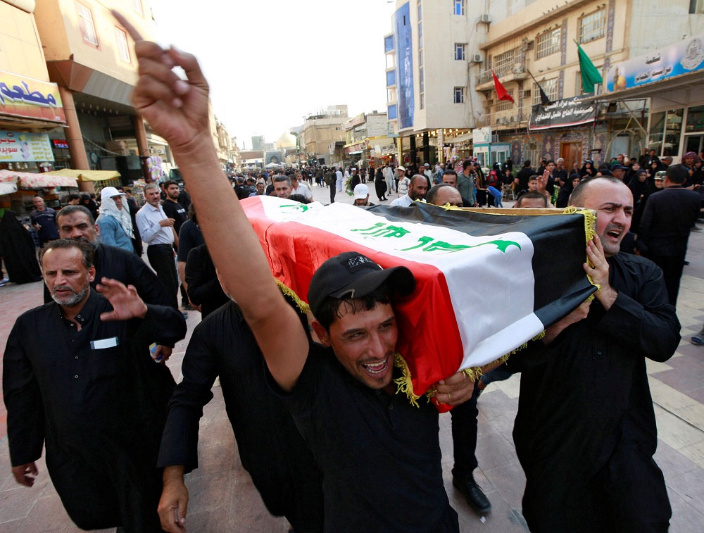 Iraqi men carry the coffin of a demonstrator, who was killed during anti-government protests, at a funeral in Najaf, Iraq October 7, 2019. u00e2u20acu201d Reuters pic