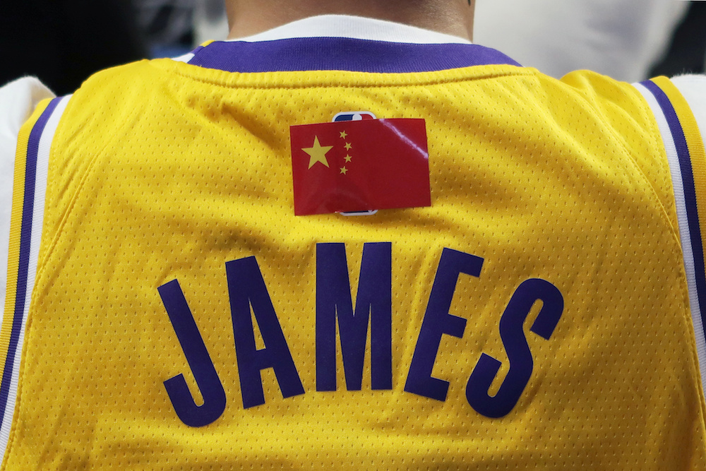 A fan is seen wearing a LeBron James jersey with an NBA logo covered by a Chinese national flag sticker during the game with the Brooklyn Nets in Shanghai October 10, 2019. u00e2u20acu201d Reuters pic