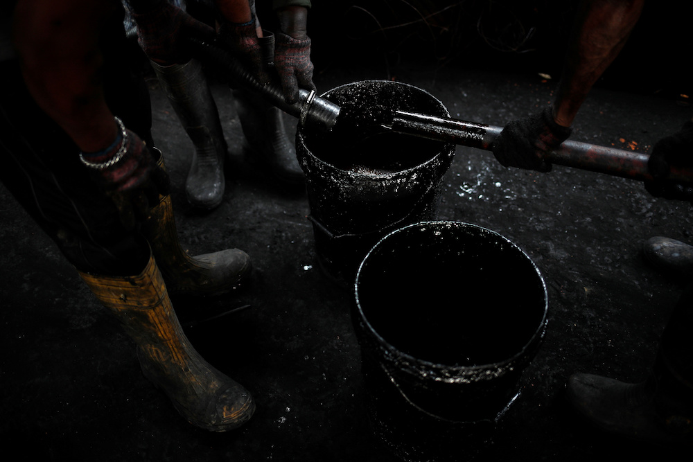Char is emptied into a bag from a furnace at a tyre pyrolysis plant in Kulai, Johor August 7, 2019. — Reuters pic