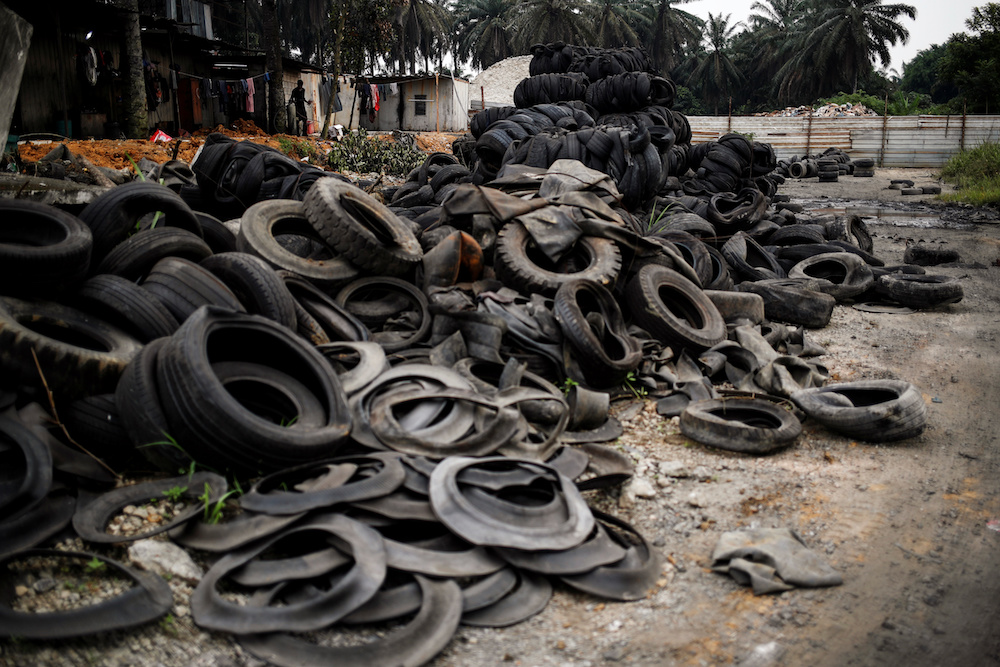 Bales of tyres from Australia and New Zealand are dumped at a compound next to the living quarters of the workers at a tyre pyrolysis plant in Kulai, Johor August 7, 2019. — Reuters pic