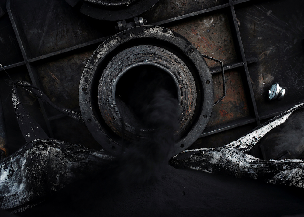 Workers siphon out fuel oil from a furnace at a tyre pyrolysis plant in Kulai, Johor August 7, 2019. — Reuters pic