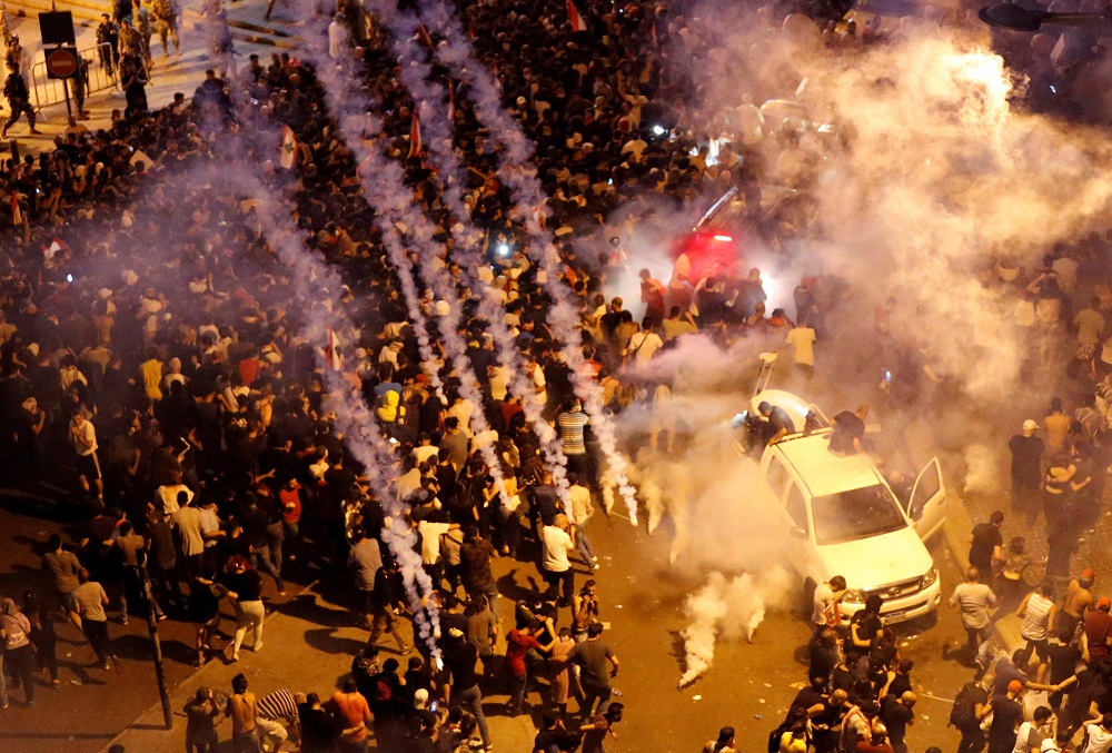 Riot police fire tear gas to disperse demonstrators during a protest targeting the government over an economic crisis, near the government palace in Beirut, Lebanon October 18, 2019. u00e2u20acu201d Reuters pic