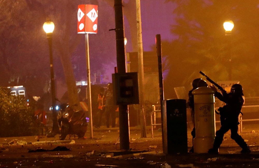 A riot police officer carries a weapon during Cataloniau00e2u20acu2122s general strike, in Barcelona October 18, 2019. u00e2u20acu201d Reuters pic