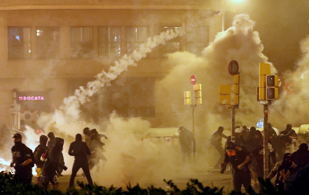 Catalan demonstrators throw back to the police a tear gas canister officer during Cataloniau00e2u20acu2122s general strike, in Barcelona October 18, 2019. u00e2u20acu201d Reuters pic