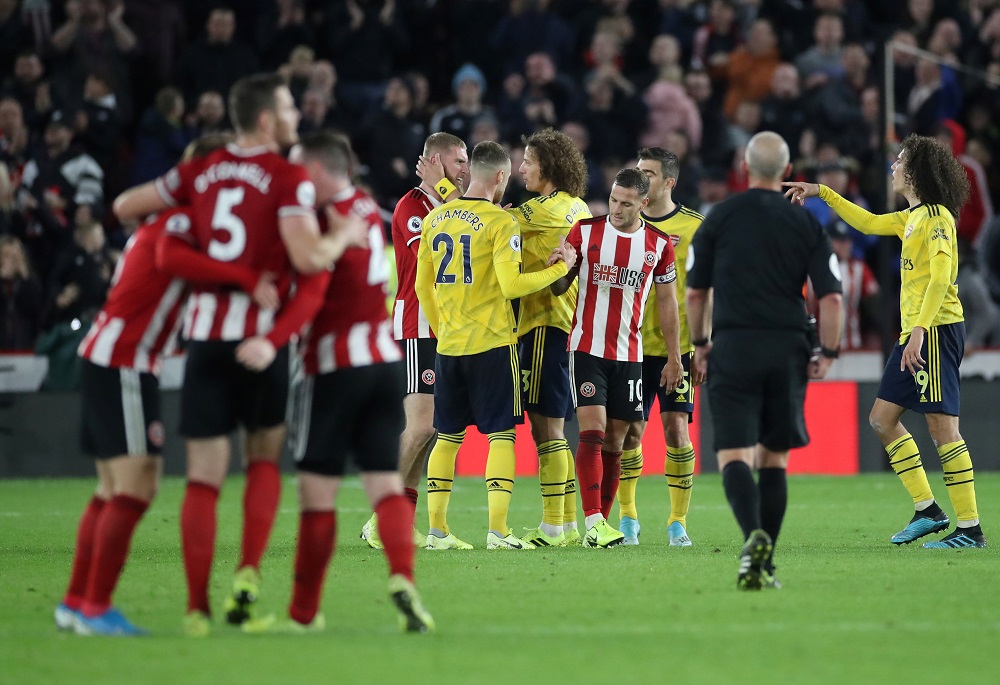 Arsenal's Matteo Guendouzi and Calum Chambers with Sheffield United's Billy Sharp and Oliver McBurnie at the end of the match at the Bramall Lane in Sheffield October 21, 2019. u00e2u20acu201d Action Images via Reuters