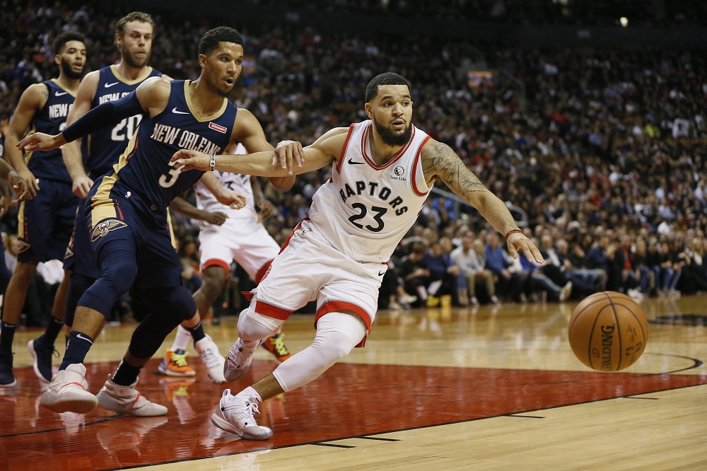 Toronto Raptors guard Fred VanVleet (23) and New Orleans Pelicans guard Josh Hart (3) go after a loose ball at Scotiabank Arena October 23, 2019. u00e2u20acu201d Picture by John E. Sokolowski-USA TODAY Sports via Reuters