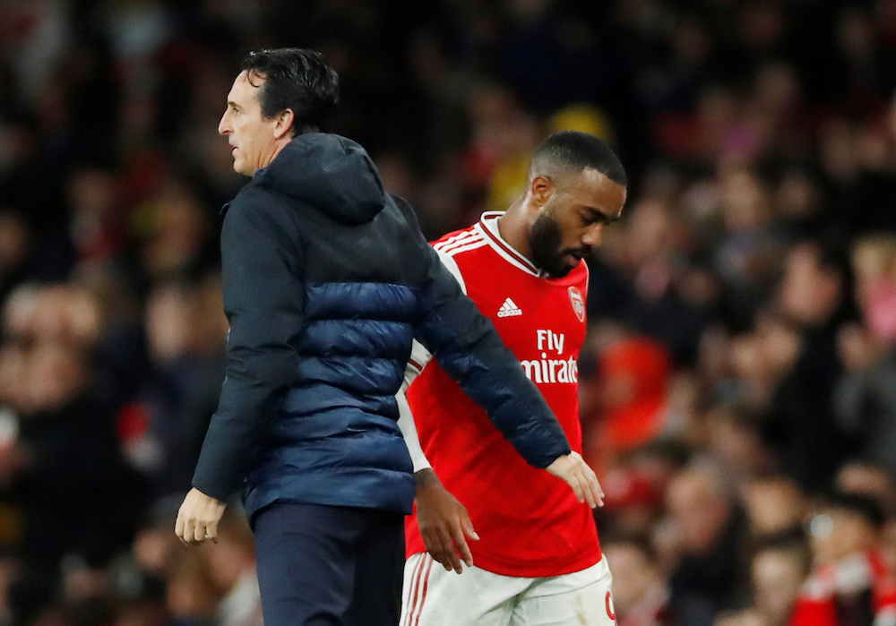 Arsenalu00e2u20acu2122s Alexandre Lacazette with manager Unai Emery after being substituted during the Europa League Group F match with Vitoria at Emirates Stadium in London October 24, 2019. u00e2u20acu201d Action Images pic via Reuters