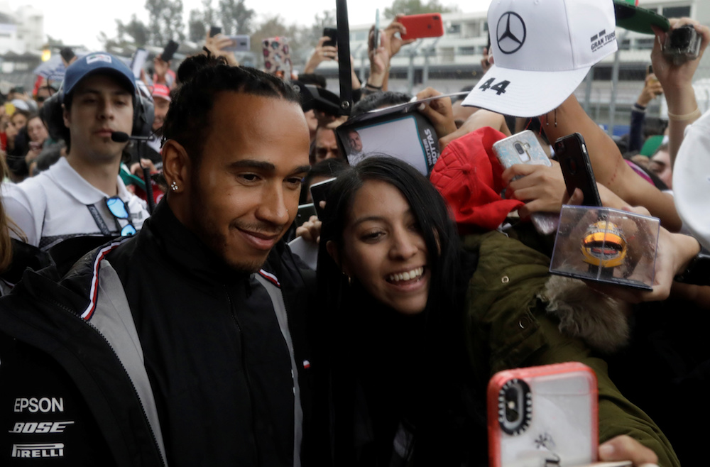 Mercedesu00e2u20acu2122 Lewis Hamilton poses for selfies with fans during the Mexican Grand Prix at Hermanos Rodriguez Circuit in Mexico City October 24, 2019. u00e2u20acu201d Reuters pic