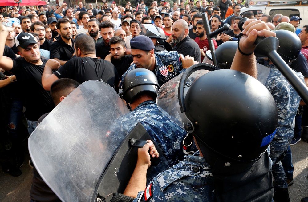 Riot police officers scuffle with Hezbollah supporters during ongoing anti-government protests in downtown Beirut October 25, 2019. u00e2u20acu201d Reuters pic