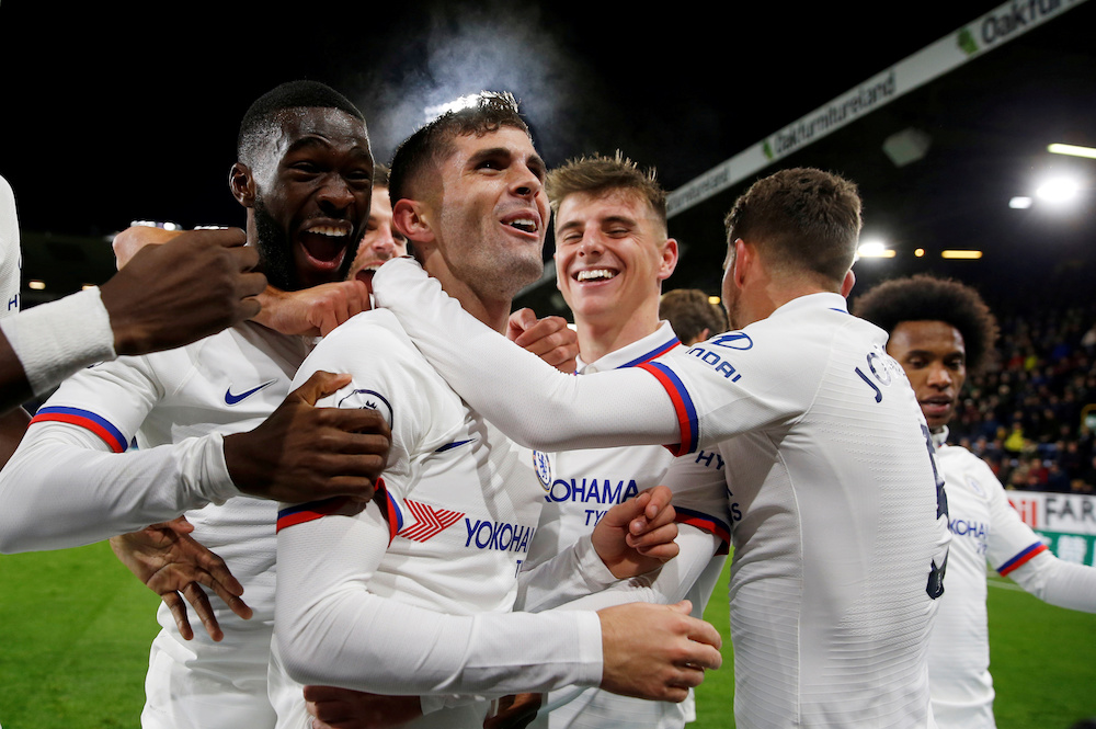 Chelseau00e2u20acu2122s Christian Pulisic celebrates scoring their third goal to complete his hat-trick with teammates during the Premier League match with Burnley at Turf Moor in Burnley October 26, 2019. u00e2u20acu201d Action Images pic via Reuters