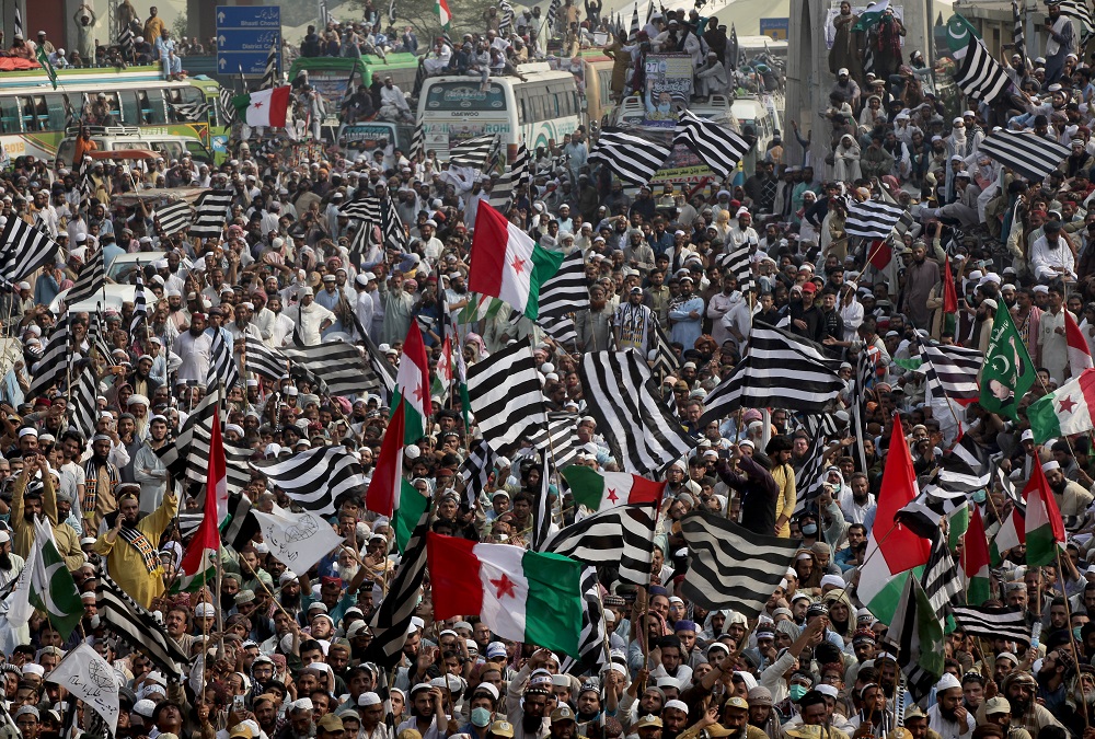 Supporters of religious and political party Jamiat Ulema-i-Islam-Fazal (JUI-F) wave flags as they listen to the speech of their leaders while heading towards Islamabad city, in Lahore October 30, 2019. u00e2u20acu201d Reuters pic