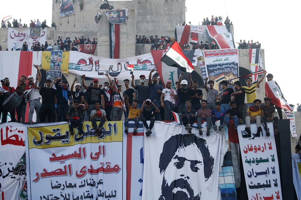 Demonstrators hang banners and images of killed protesters during an anti-government protest in Baghdad October 30, 2019. — Reuters pic