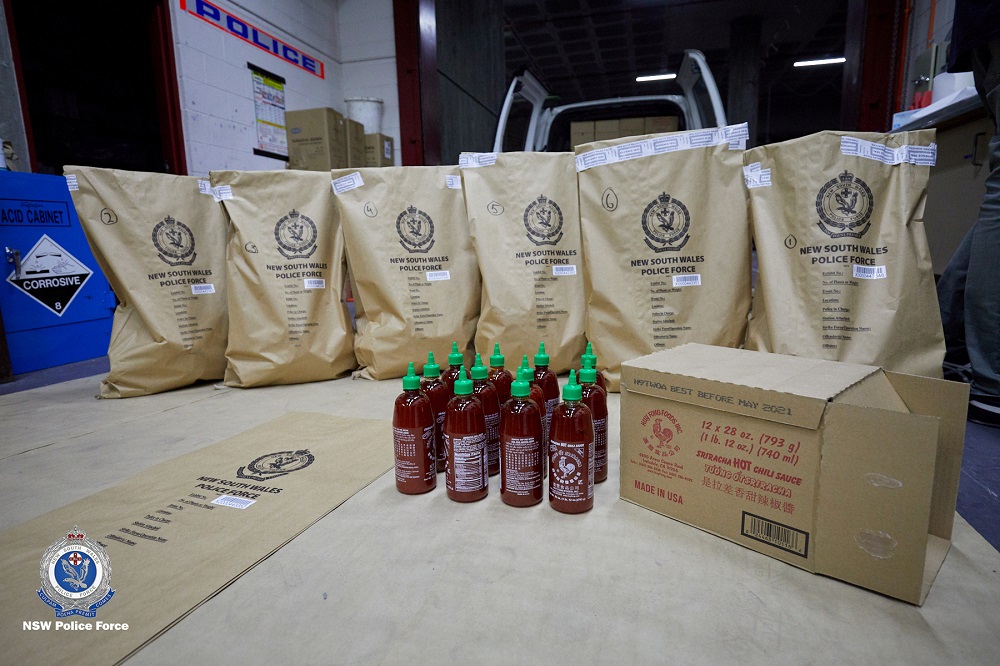 Seized bottles of Sriracha hot chilli sauce, which were later found to conceal crystal meth, or ice, are seen in Sydney October 15, 2019. u00e2u20acu201d Picture by New South Wales Police Force via Reuters