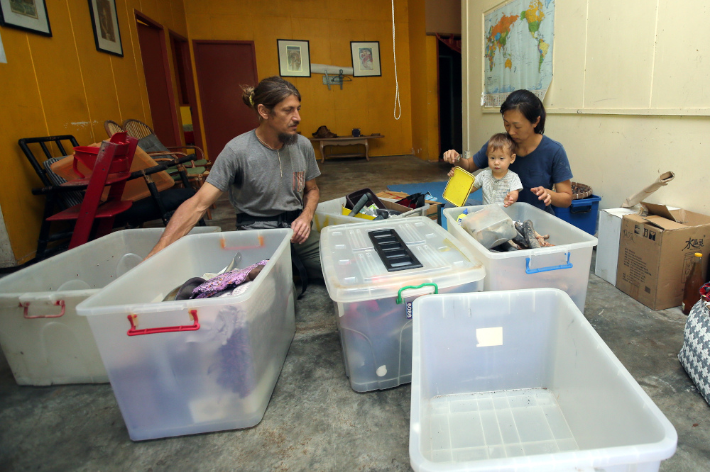 The owners of Permaculture Farm Amy Tan, 40, and her husband Vladislav Kuta, 46, packing up their things after their farm in Lenggong was closed following eviction by the state government October 1, 2019. — Picture by Farhan Najib