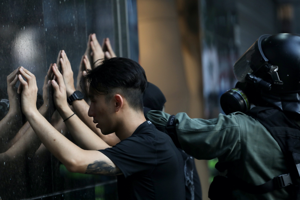 Riot police detain anti-government protesters during a protest on China's National Day in Hong Kong October 1, 2019. u00e2u20acu201d Reuters pic