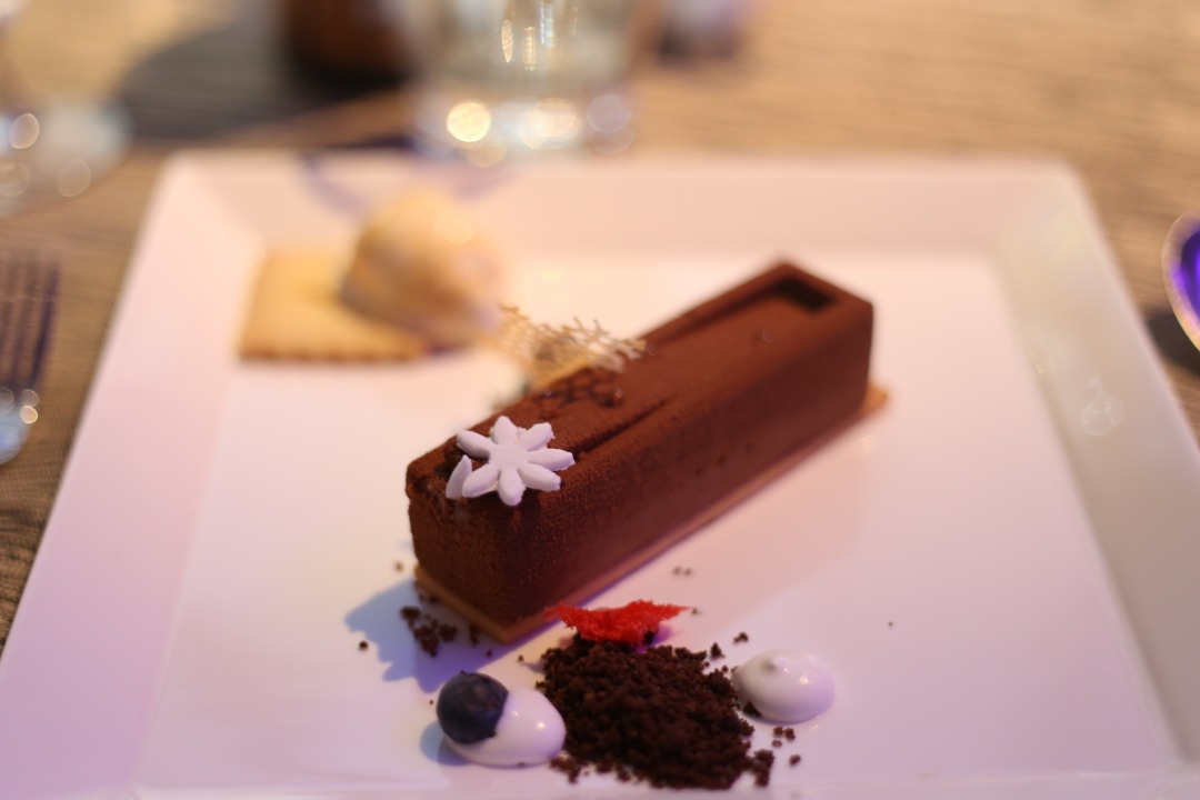 Layered Araguani 72 per cent chocolate mousse cake served with maracuya gelee, mago confit, chocolate crumble and mango yoghurt ice cream by Hilton Kota Kinabalu.