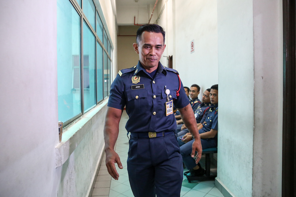 Damansara Fire and Rescue Department fireman Mohamad Afzan Majid is pictured at the Shah Alam High Court October 2, 2019. u00e2u20acu201d Picture by Yusof Mat Isa