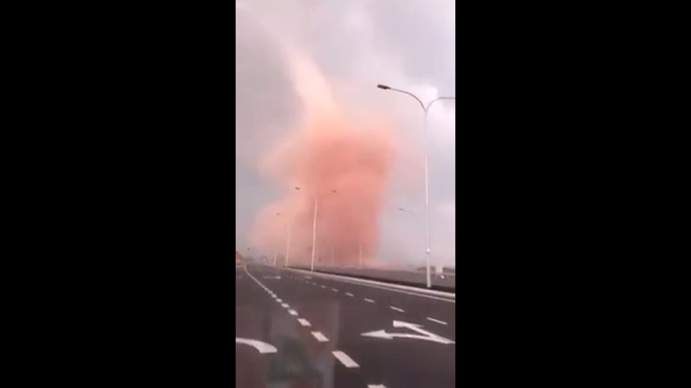 The under one minute clip shows a motorist driving through a rosy hued dust devil in Pengerang. u00e2u20acu201d Screengrab via Facebook/We Are Malaysians