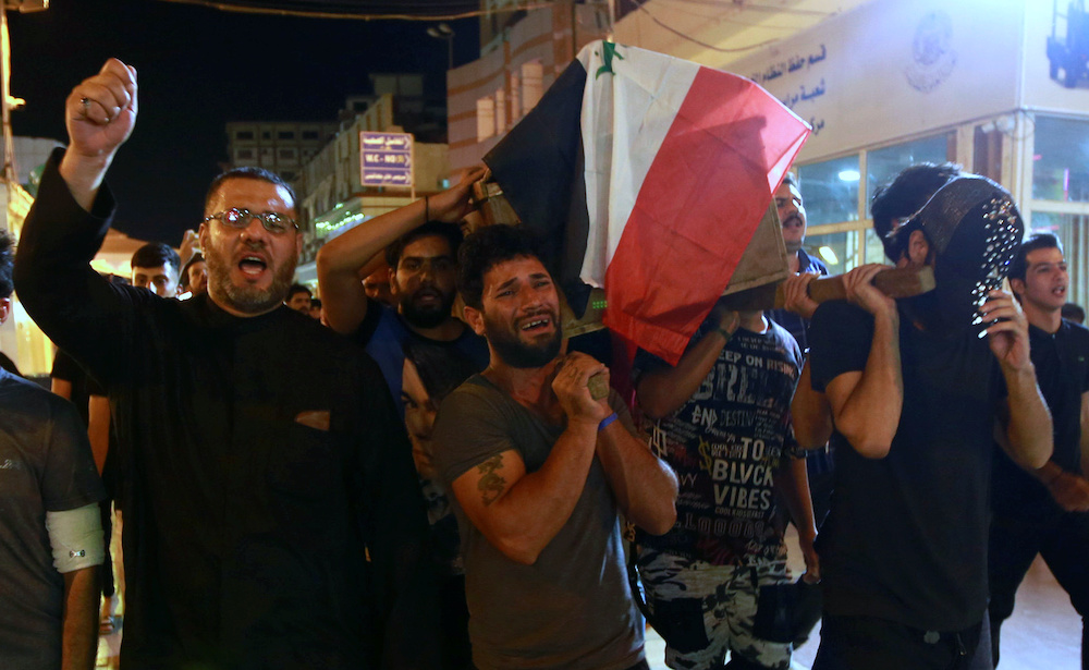 Mourners carry the coffin of a protester, who was killed in Tuesday's demonstrations in Baghdad, during a funeral in Najaf, Iraq, October 2, 2019. u00e2u20acu201d Reuters pic