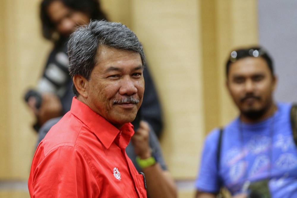 Umno deputy president Datuk Seri Mohamad Hasan smiles during a press conference at PWTC in Kuala Lumpur October 3, 2019. u00e2u20acu201d Picture by Ahmad Zamzahuri