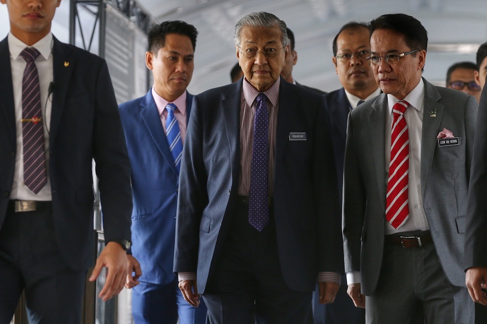 Prime Minister Tun Dr Mahathir Mohamad walks into the Parliament building in Kuala Lumpur October 8, 2019. u00e2u20acu201d Picture by Ahmad Zamzahuri
