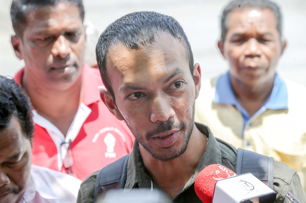 Kuasa field officer Shazni Rashid speaks to reporters in front of the MACC office in Ipoh October 9, 2019. — Picture by Farhan Najib