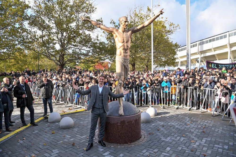 Swedenu00e2u20acu2122s biggest football star, Los Angeles Galaxyu00e2u20acu2122s forward Zlatan Ibrahimovic poses next to the 2.7m bronze statue of him, after the unveiling ceremony in Malmo, Sweden October 8, 2019. u00e2u20acu201d AFP pic