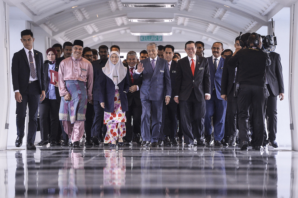 Prime Minster Tun Dr Mahathir Mohamad, Deputy Prime Minister Datuk Seri Dr Wan Azizah Wan Ismail and Finance Minister Lim Guan Eng arrive in Parliament for the tabling of Budget 2020 on October 11, 2019. u00e2u20acu201d Picture by Miera Zulyana