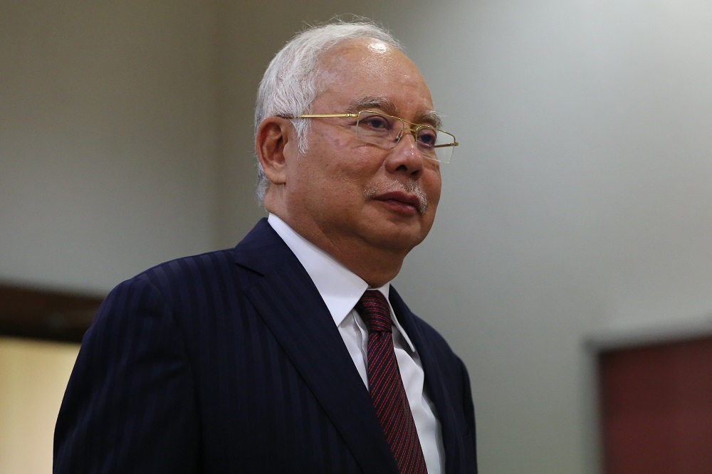 Former Prime Minister Datuk Seri Najib Razak walks out of the courtroom for a break at the Kuala Lumpur High Court Complex October 14, 2019. u00e2u20acu201d Picture by Yusof Mat Isa