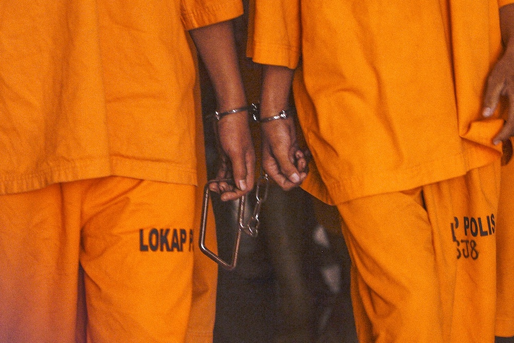 BE MINDFUL OF RACIAL STEREOTYPING WHEN USING THIS PIC  Handcuffed suspects are seen at the Petaling Jaya Court Complex October 18, 2019. u00e2u20acu201d Picture by Miera Zulyana