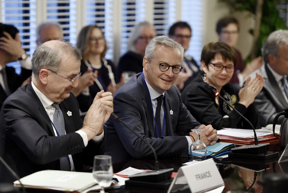 Franceu00e2u20acu2122s Economy Minister Bruno Le Maire (centre) looks on during the IMF and World Bank Fall Meetings in Washington October 17, 2019. u00e2u20acu201d AFP pic