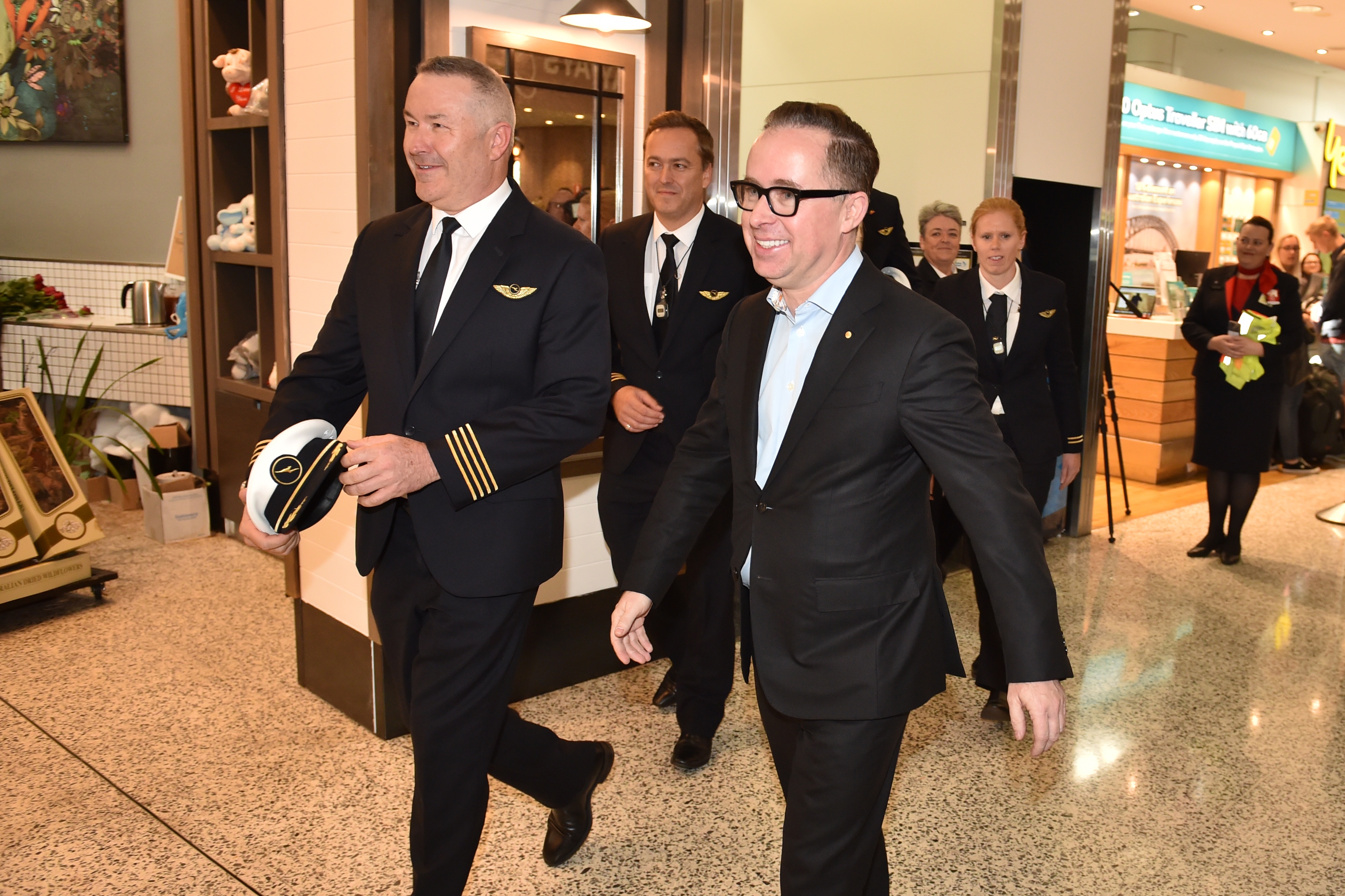 Qantas Group CEO Alan Joyce (centre) and Qantas pilot, Captain Sean Golding (left) arrive after completing a non-stop test flight from New York to Sydney at Sydney international airport on October 20, 2019. u00e2u20acu201d AFP picnn
