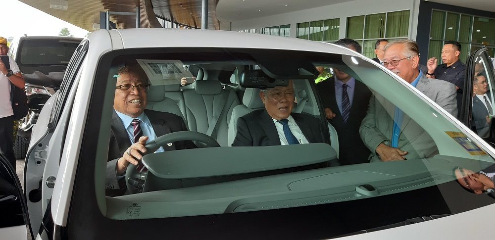 Sarawak Chief Minister Datuk Patinggi Abang Johari Openg giving a demonstration on the hydrogen-powered sports utility vehicle in Kuching October 23, 2019. u00e2u20acu201d Picture by Sulok Tawie 