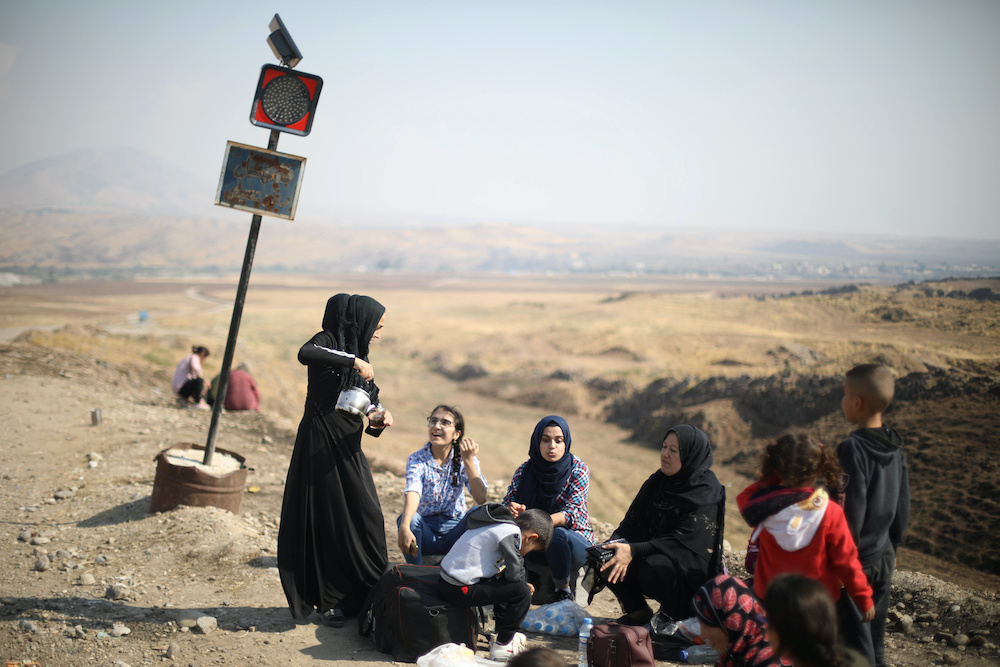 Displaced Kurds stuck at a border after a Turkish offensive in northeastern Syria, wait to try cross to the Iraqi side, at the Semalka crossing, next Derik city, Syria, October 21, 2019. u00e2u20acu201d Reuters pic