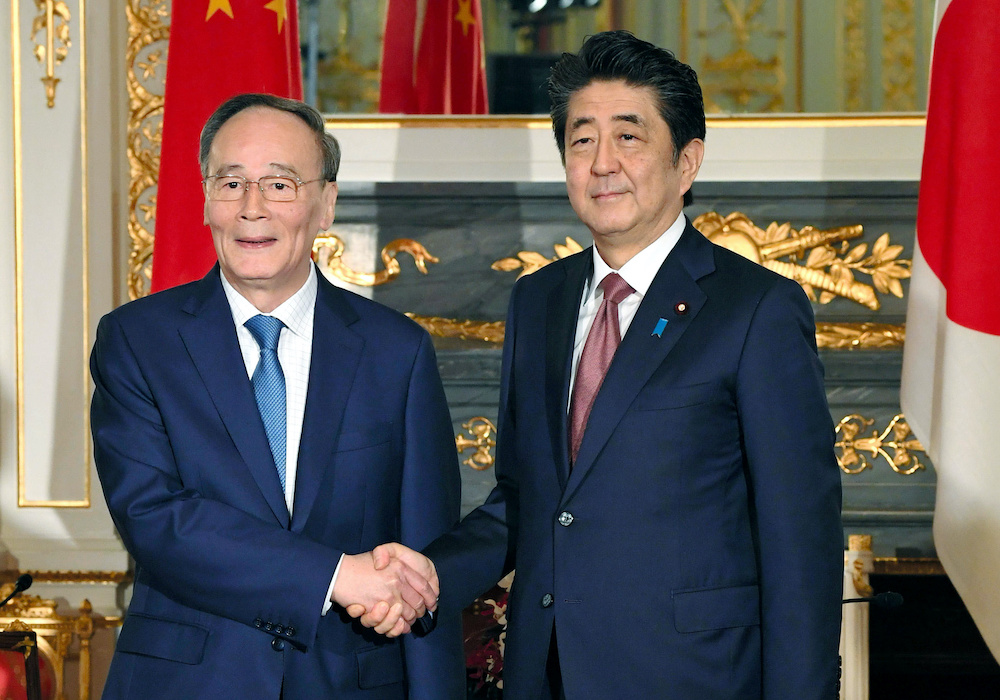 Chinese Vice President Wang Qishan meets with Japan's Prime Minister Shinzo Abe at Akasaka State Guest House in Tokyo October 23, 2019, in this photo released by Kyodo. u00e2u20acu201d Reuters picnn