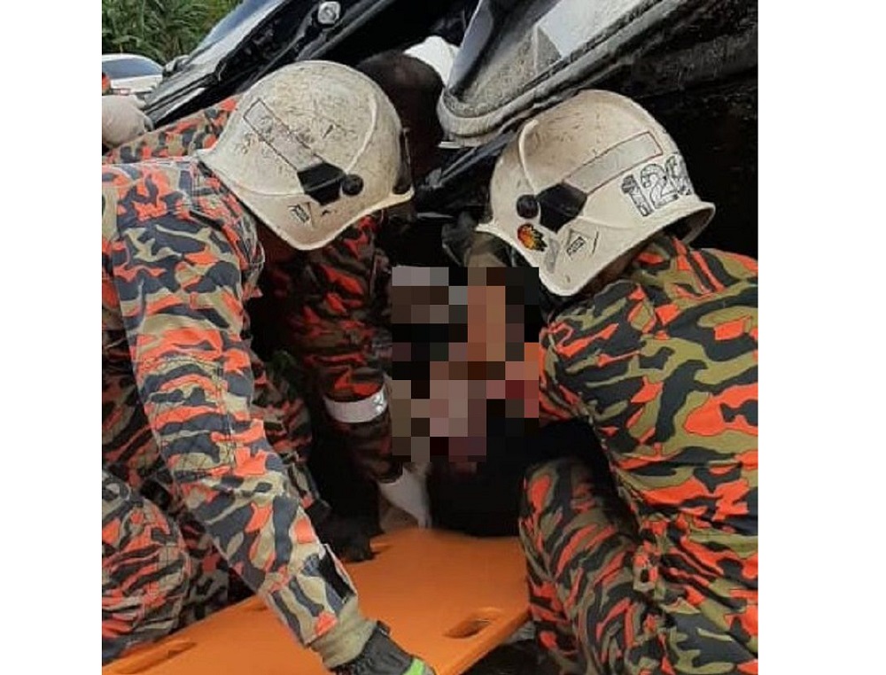 Firemen extricating a seriously injured female passenger out of a wrecked car after it was involved in a head-on collision with a sports utility vehicle along Miri-Bintulu road  October 29, 2019. u00e2u20acu201d Picture courtesy of Lopeng Fire and Rescue Station 