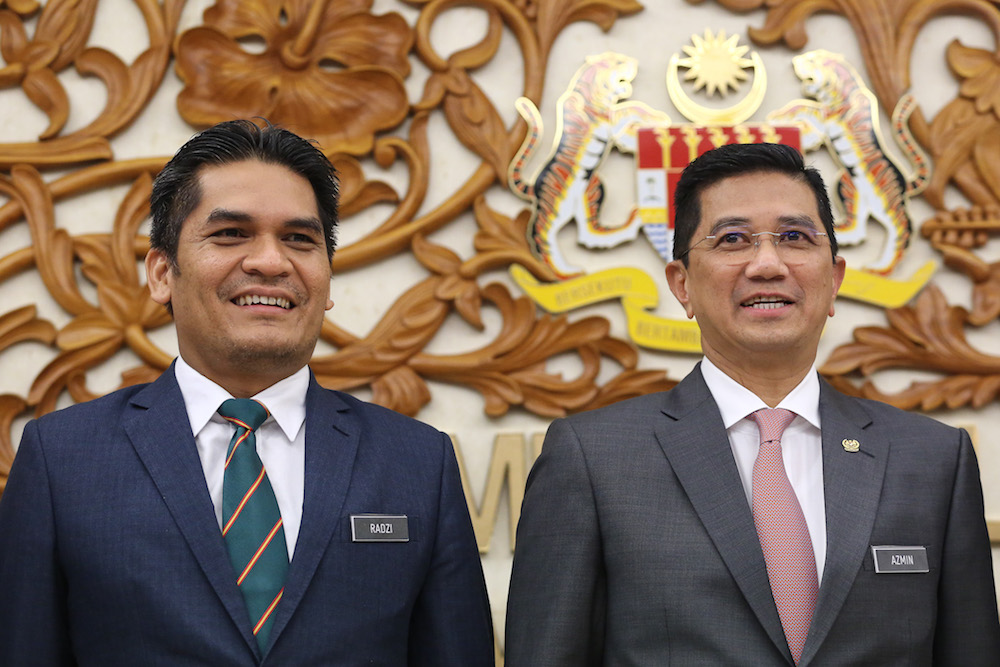 Economic Affairs Minister Datuk Seri Mohamed Azmin Ali and his deputy Mohd Radzi Md Jidin are pictured in Parliament October 30, 2019. u00e2u20acu201d Picture by Yusof Mat Isa