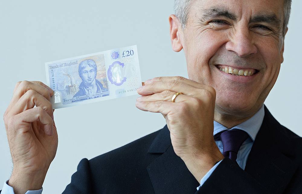 Governor of the Bank of England Mark Carney poses with the new u00c2u00a320 note featuring late British painter JMW Turner. u00e2u20acu201d Leon Neal/Pool pic via AFP