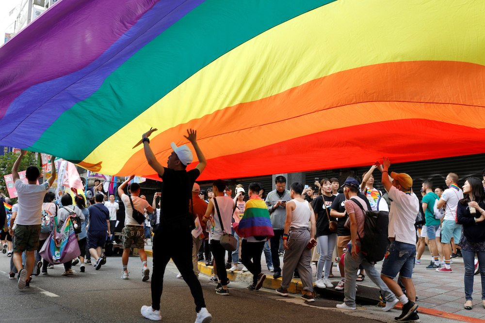 Participants march under a giant rainbow flag during the LGBT Pride parade in Taipei October 26, 2019. u00e2u20acu201d Reuters pc