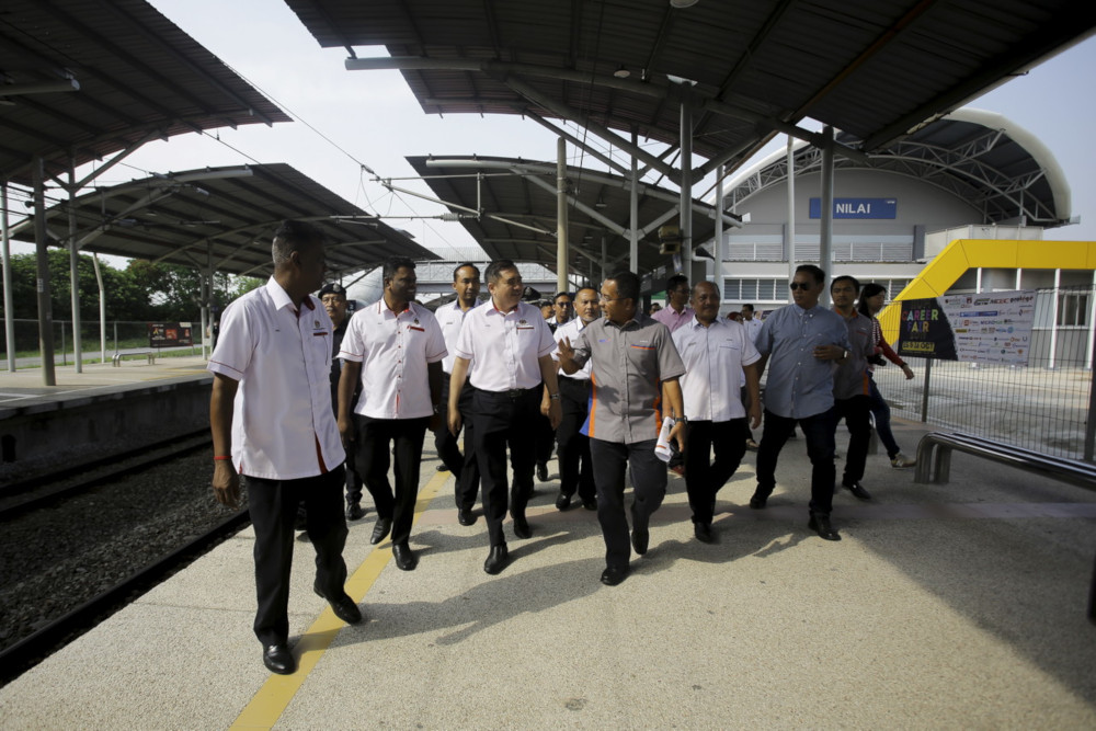 Transport Minister Anthony Loke is briefed by Rail Asset Corporation general manager Azhar Ahmad (3rd right) at the Nilai Station October 12, 2019. u00e2u20acu201d Bernama pic 